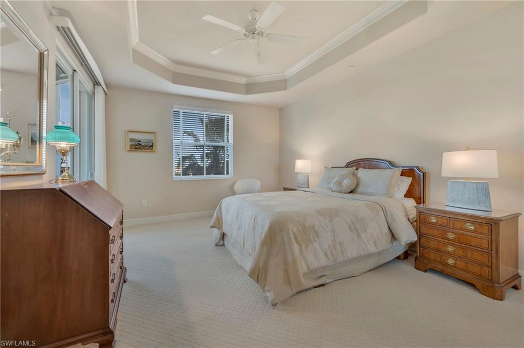 580 El Camino Real, Unit 3402 Naples, FL 34119 - Photo 13 of 35 a bedroom with a bed and window