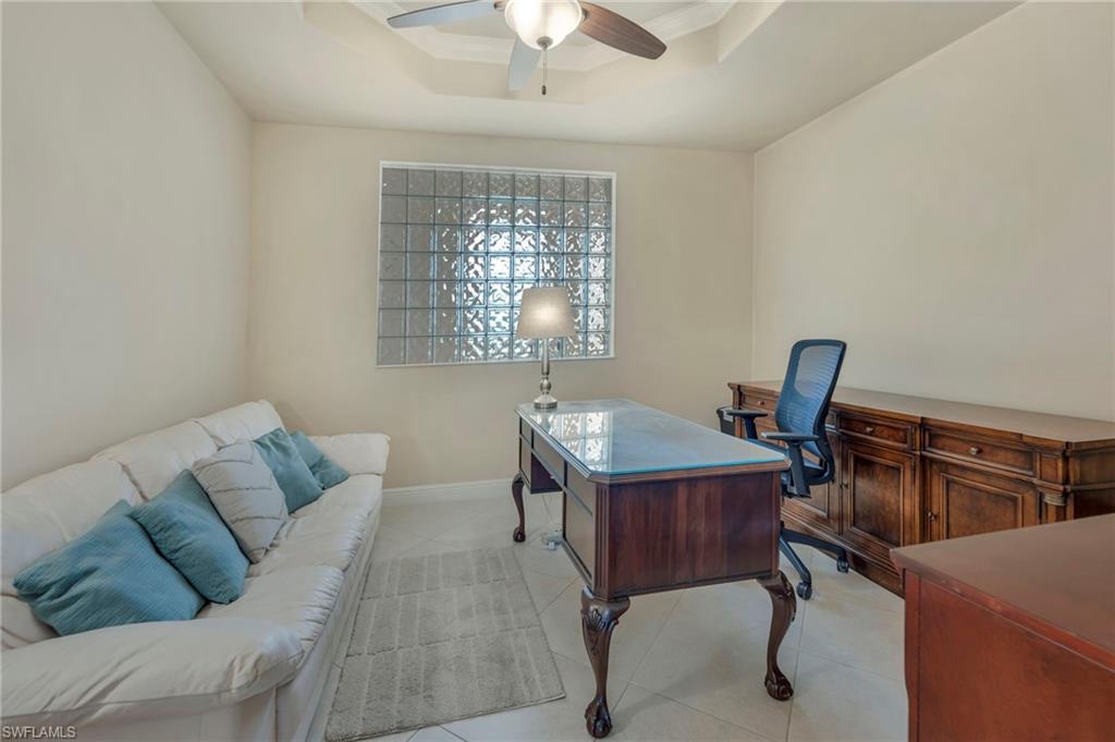 580 El Camino Real, Unit 3402 Naples, FL 34119 - Photo 15 of 35 a view of a workspace with furniture and a window