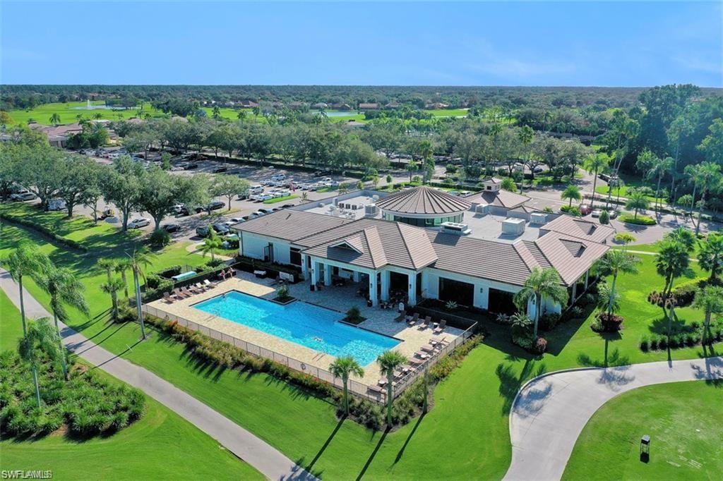 580 El Camino Real, Unit 3402 Naples, FL 34119 - Photo 22 of 35 a view of a house with a big yard