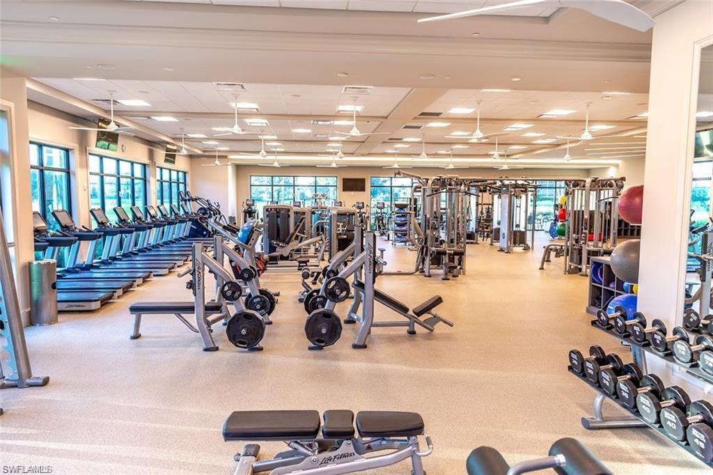 580 El Camino Real, Unit 3402 Naples, FL 34119 - Photo 29 of 35 a view of a room with gym equipment