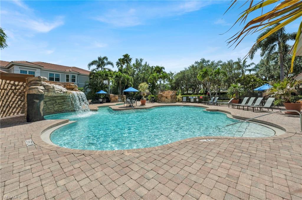 580 El Camino Real, Unit 3402 Naples, FL 34119 - Photo 35 of 35 a backyard of a house with outdoor seating
