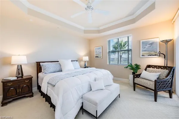 a spacious bedroom with a bed and a couch