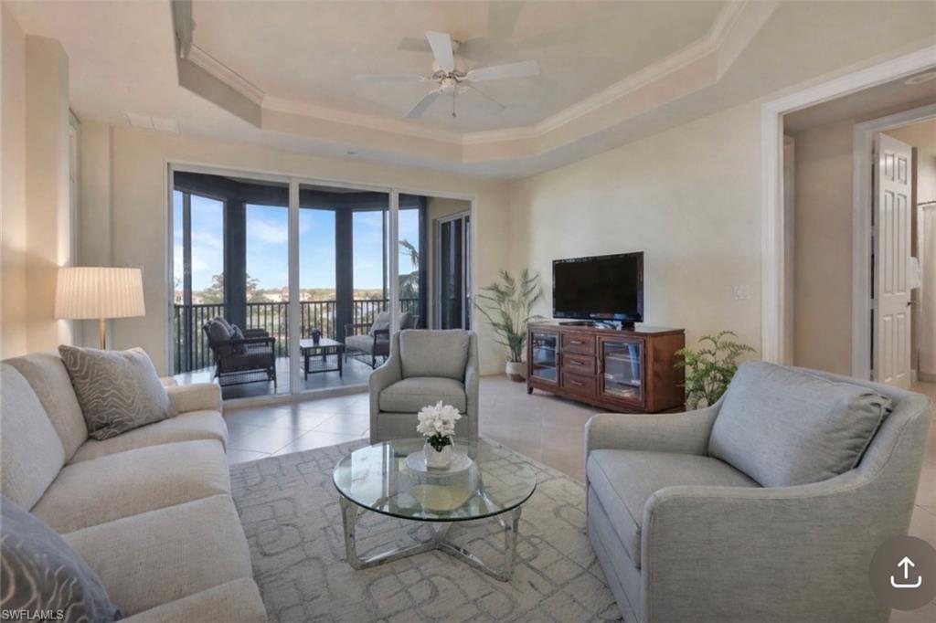 580 El Camino Real, Unit 3402 Naples, FL 34119 - Photo 8 of 35 a living room with furniture and a flat screen tv