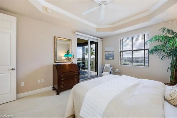 a bedroom with a bed and a couch