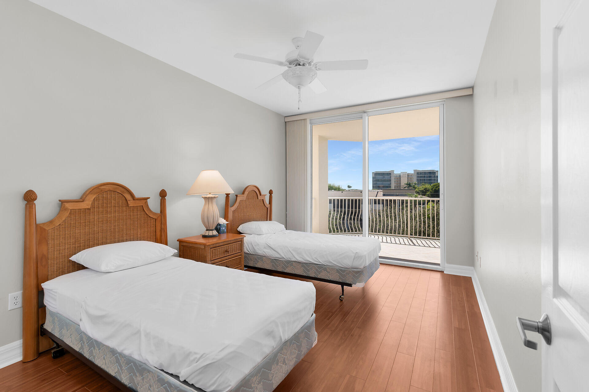 1111 Swallow Avenue, Unit 1401 Marco Island, FL 34145 - Photo 36 of 36 a bedroom with two beds and a large window