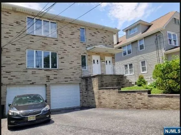 a car parked in front of a brick building