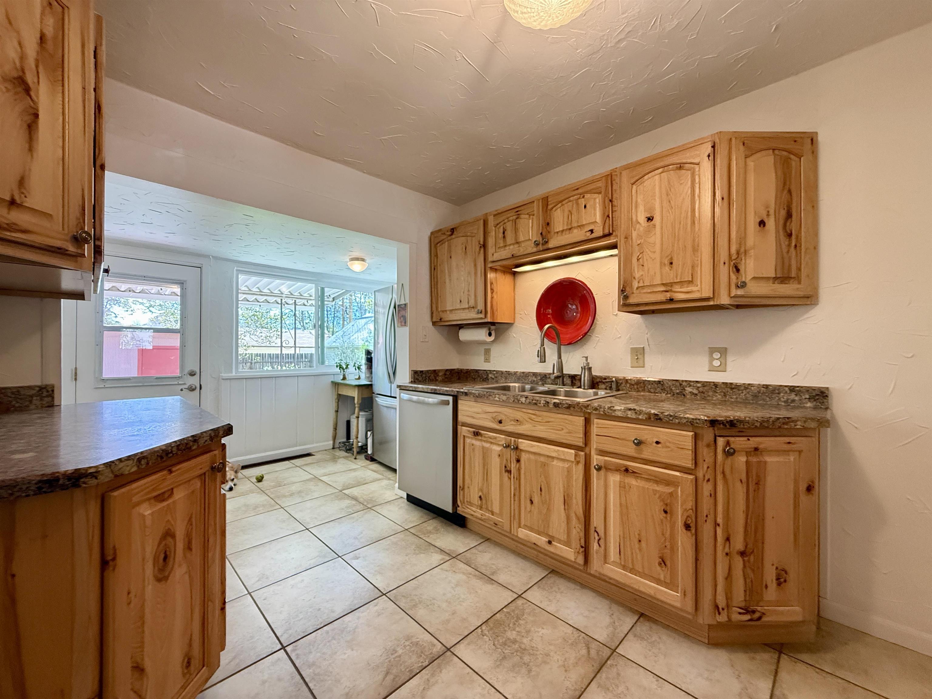 435 West 4th Street Palisade, CO 81526 - Photo 11 of 28 a view of a kitchen with granite countertop cabinets