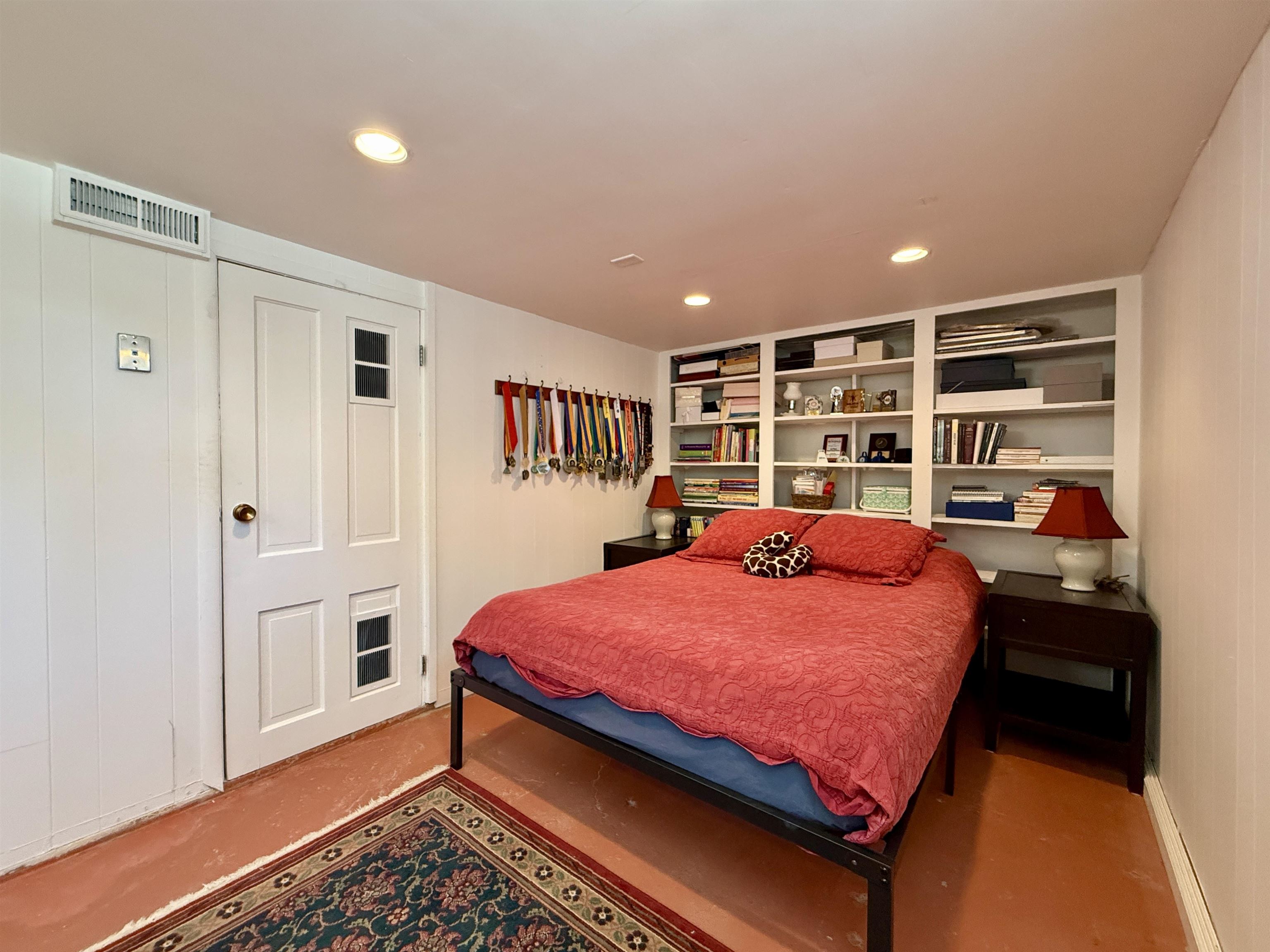 435 West 4th Street Palisade, CO 81526 - Photo 18 of 28 a bed room with a bed and a book shelf