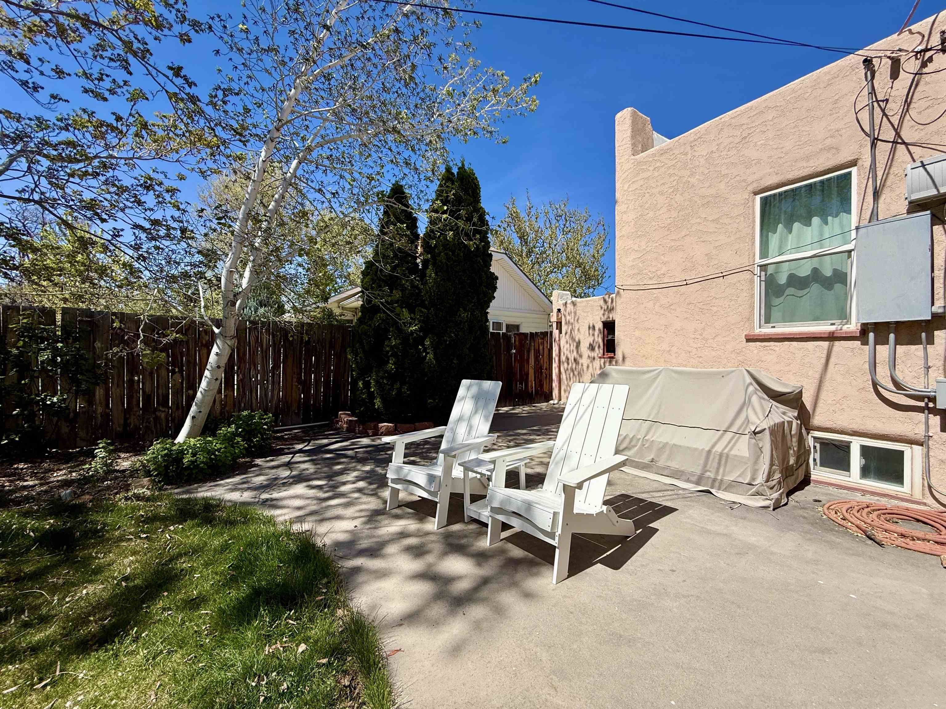 435 West 4th Street Palisade, CO 81526 - Photo 20 of 28 a view of backyard with a table and chairs