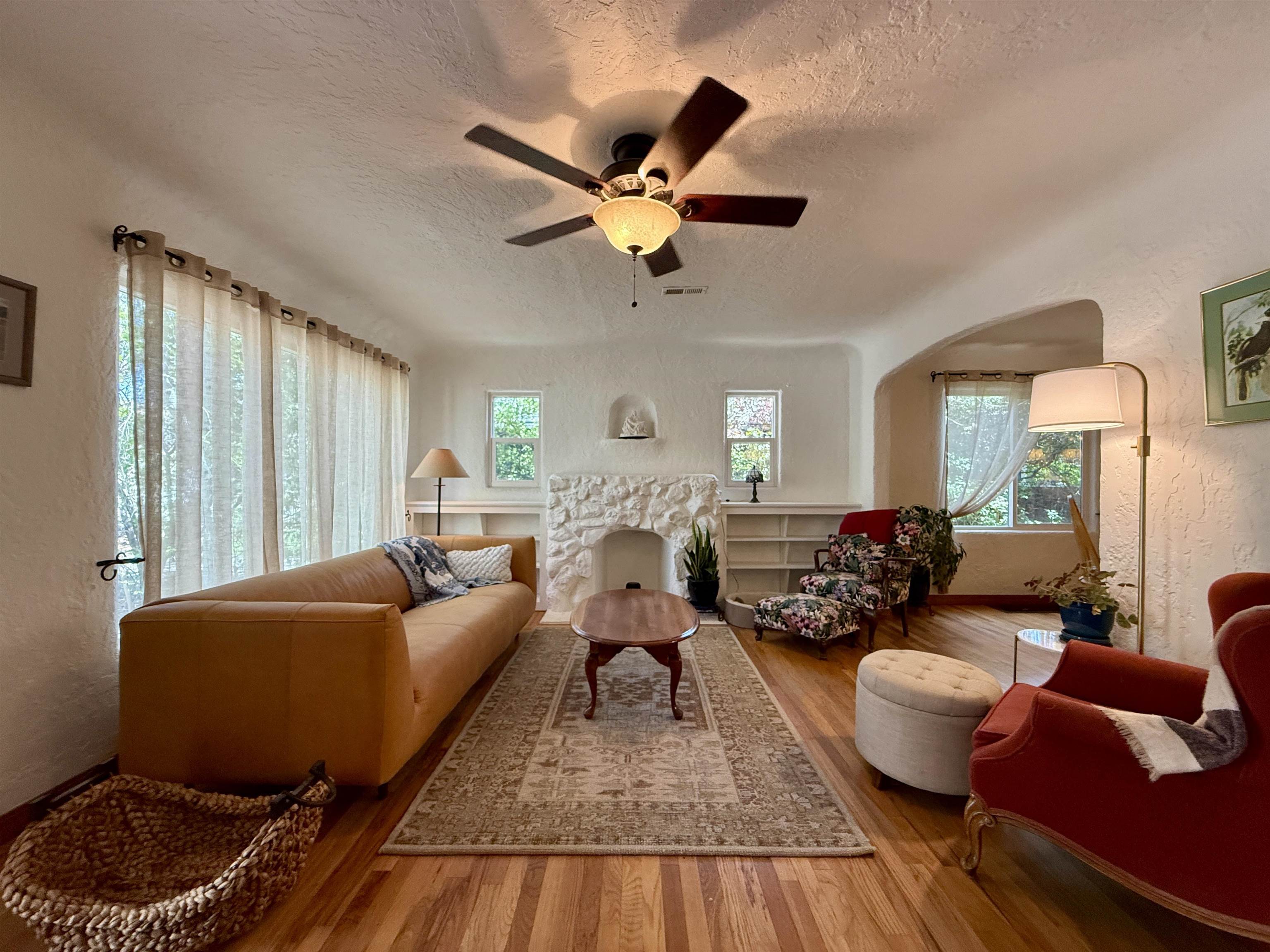 435 West 4th Street Palisade, CO 81526 - Photo 4 of 28 a living room with furniture ceiling fan and a window