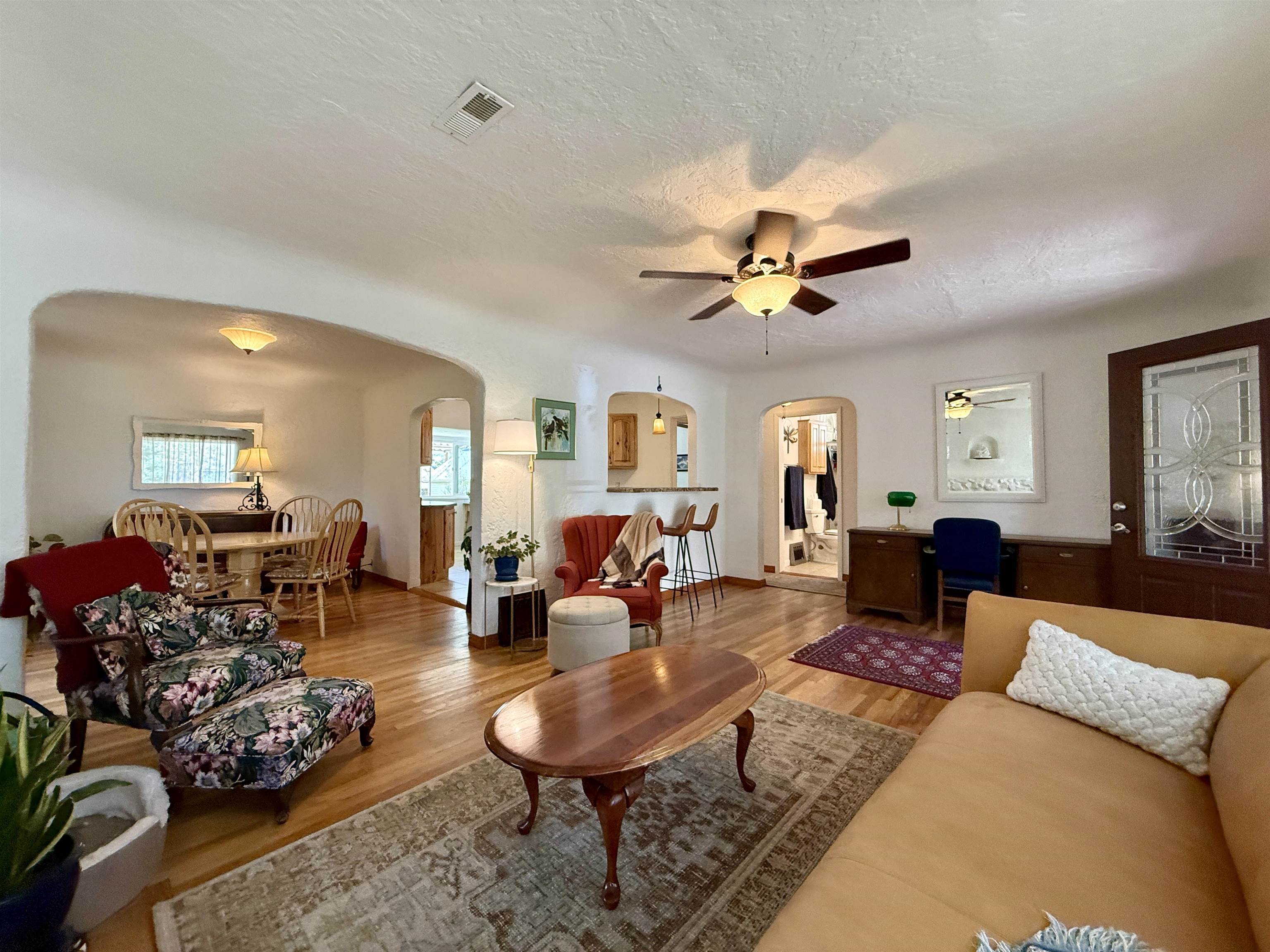 435 West 4th Street Palisade, CO 81526 - Photo 6 of 28 a living room with furniture a rug and a window