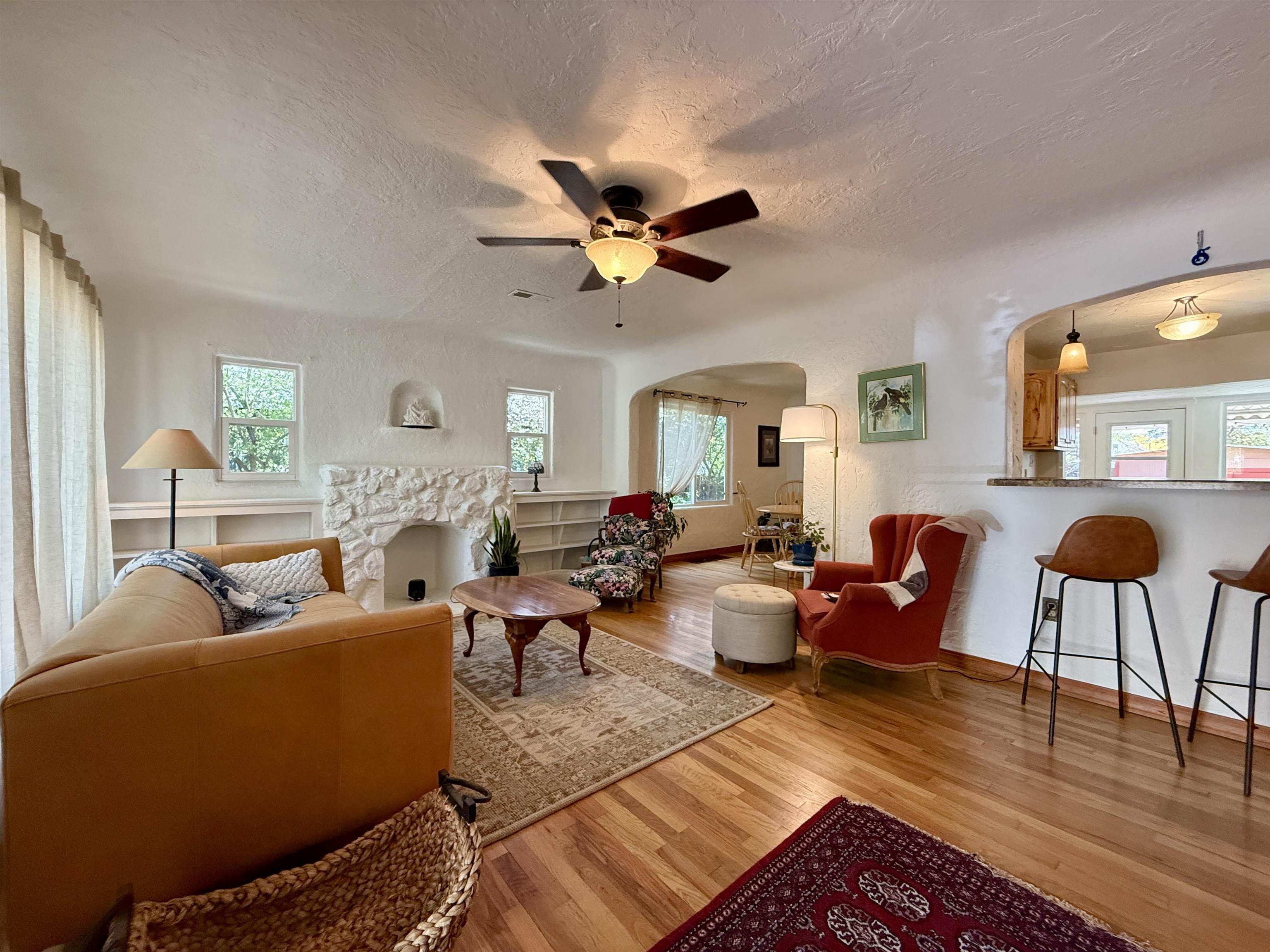 435 West 4th Street Palisade, CO 81526 - Photo 7 of 28 a living room with furniture a chandelier and a window