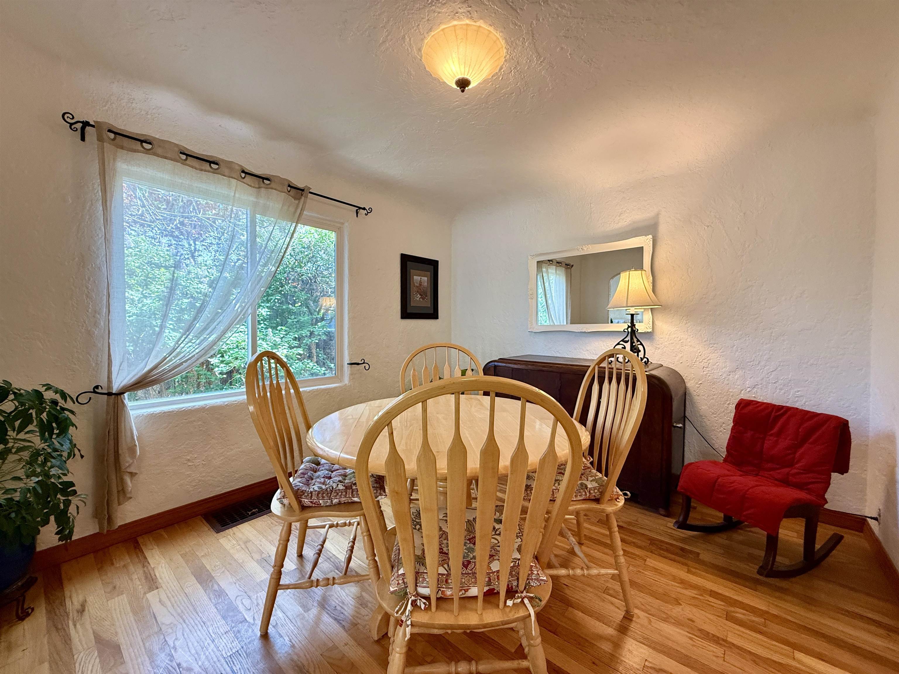 435 West 4th Street Palisade, CO 81526 - Photo 10 of 28 a view of a dining room with furniture window and wooden floor