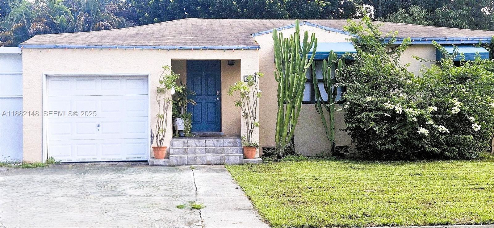 243 Northwest 62nd Court Miami, FL 33126 - Photo 2 of 19 a front view of a house