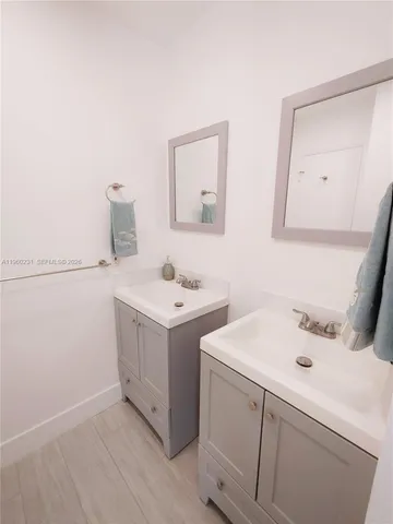 a bathroom with a sink a toilet and bathtub
