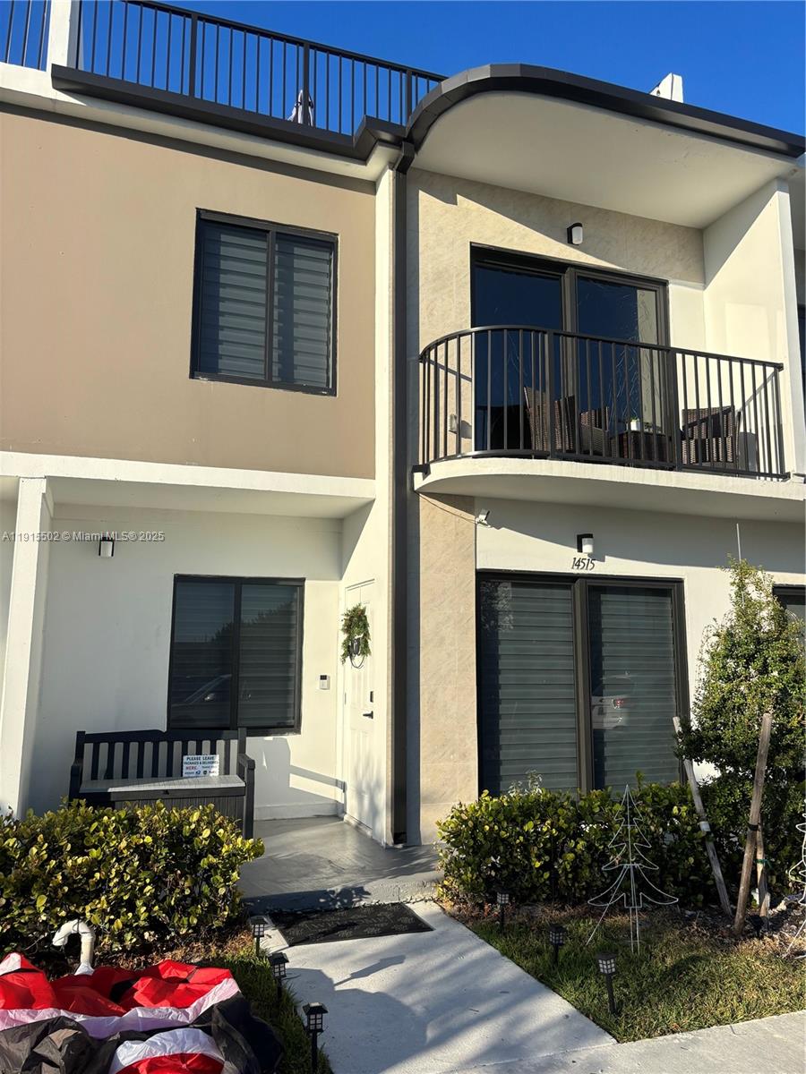 a front view of a house with a garage