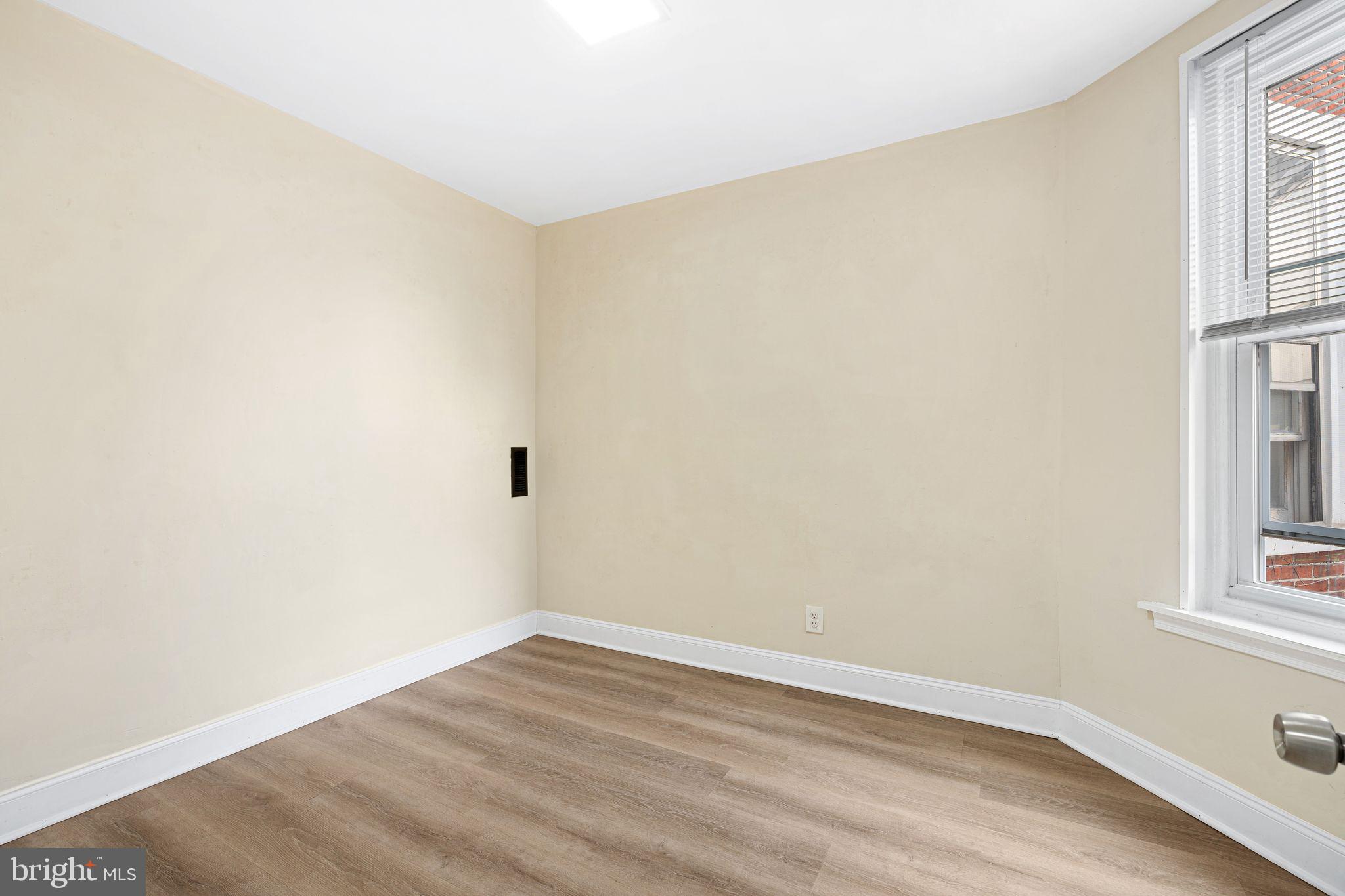 5428 Regent Street Philadelphia, PA 19143 - Photo 21 of 28 wooden floor in an empty room