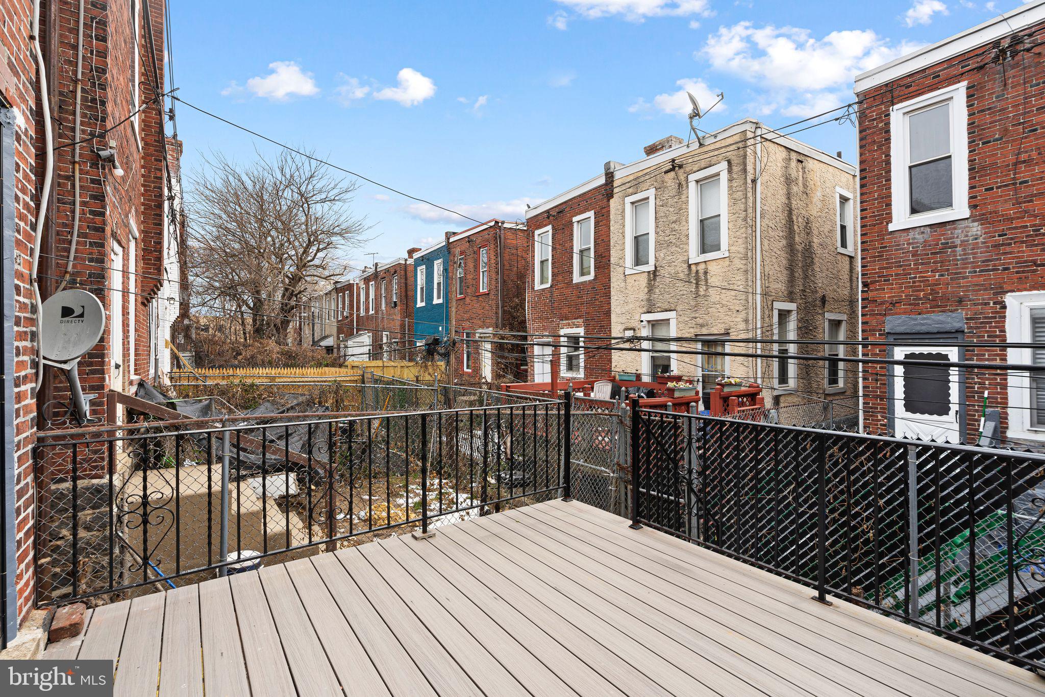 5428 Regent Street Philadelphia, PA 19143 - Photo 9 of 28 a view of a roof deck with wooden floor and fence