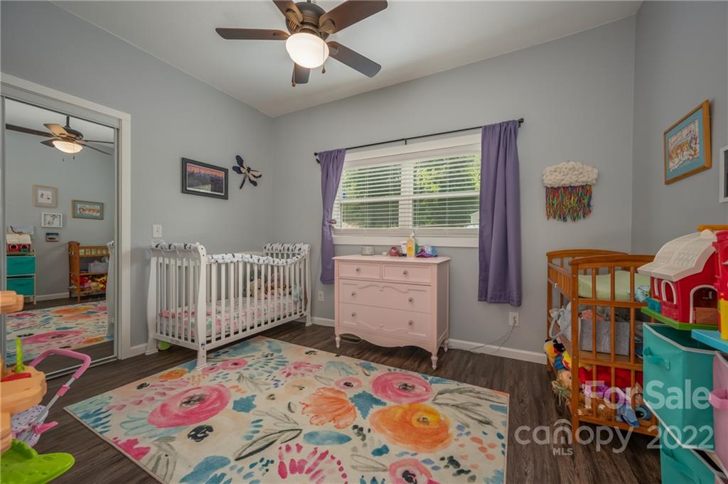 225 South Hillside Street Rutherfordton, NC 28139 - Photo 28 of 31 a bedroom with a bed and a dresser in it