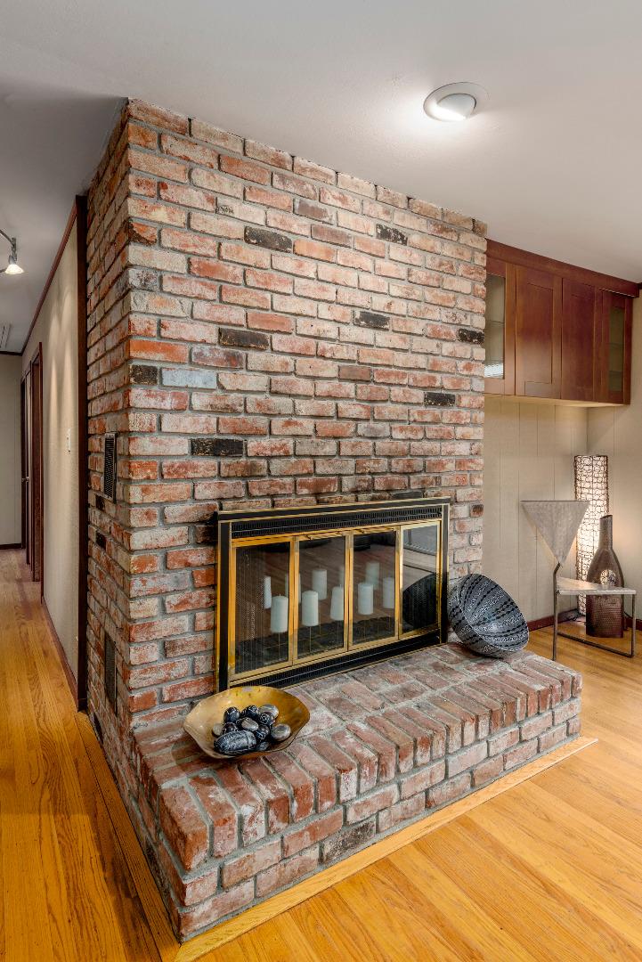 275 Martinez Road Woodside, CA 94062 - Photo 22 of 48 a living room with a couch and a fireplace
