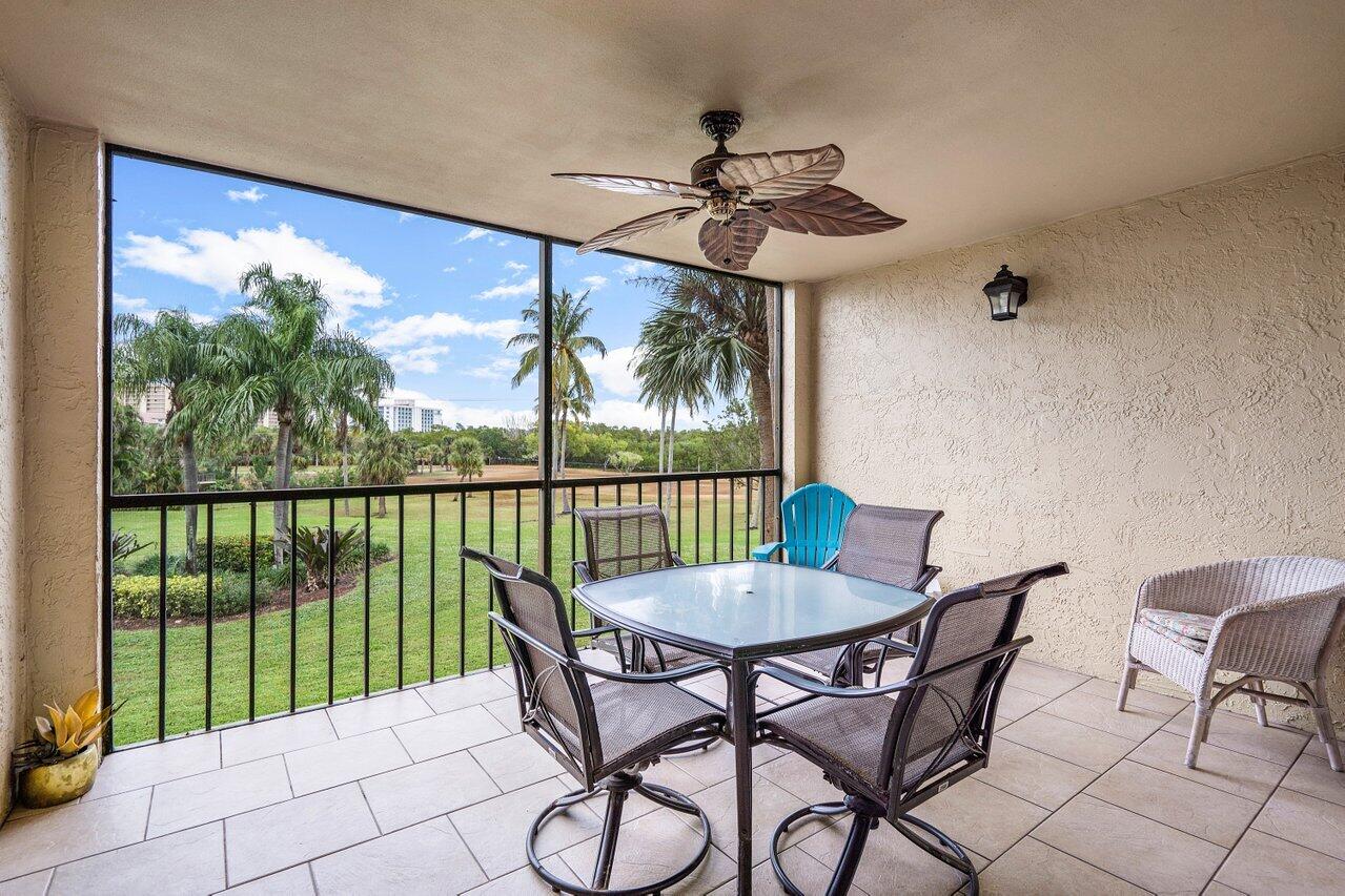 275 Palm Avenue, Unit C206 Jupiter, FL 33477 - Photo 13 of 25 a view of a dining room with furniture window and outside view
