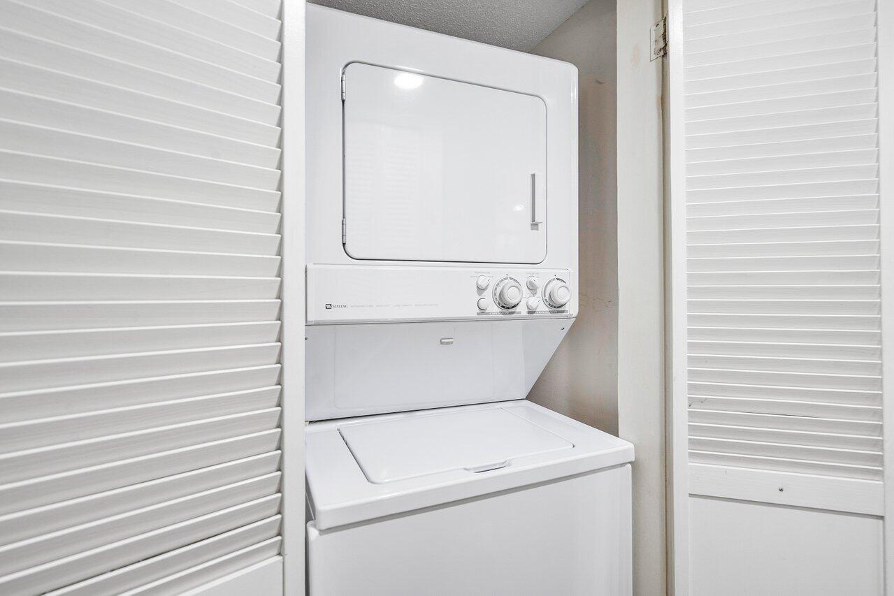 275 Palm Avenue, Unit C206 Jupiter, FL 33477 - Photo 21 of 25 a utility room with dryer and washer