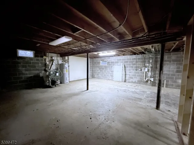 a view of empty room with wooden ceiling