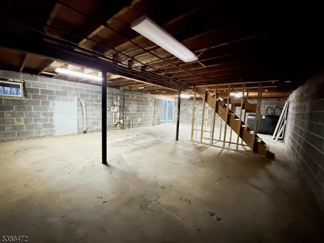 a view of empty room with wooden ceiling