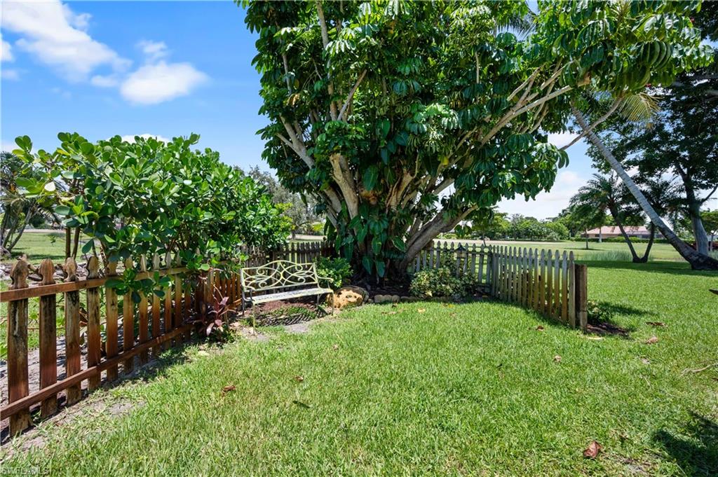 397 Forest Hills Boulevard Naples, FL 34113 - Photo 27 of 29 Sitting area off of golf course in the backyard.
