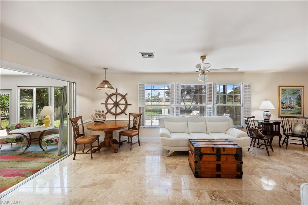 397 Forest Hills Boulevard Naples, FL 34113 - Photo 9 of 29 Sitting area with bright and cheery natural light throughout.