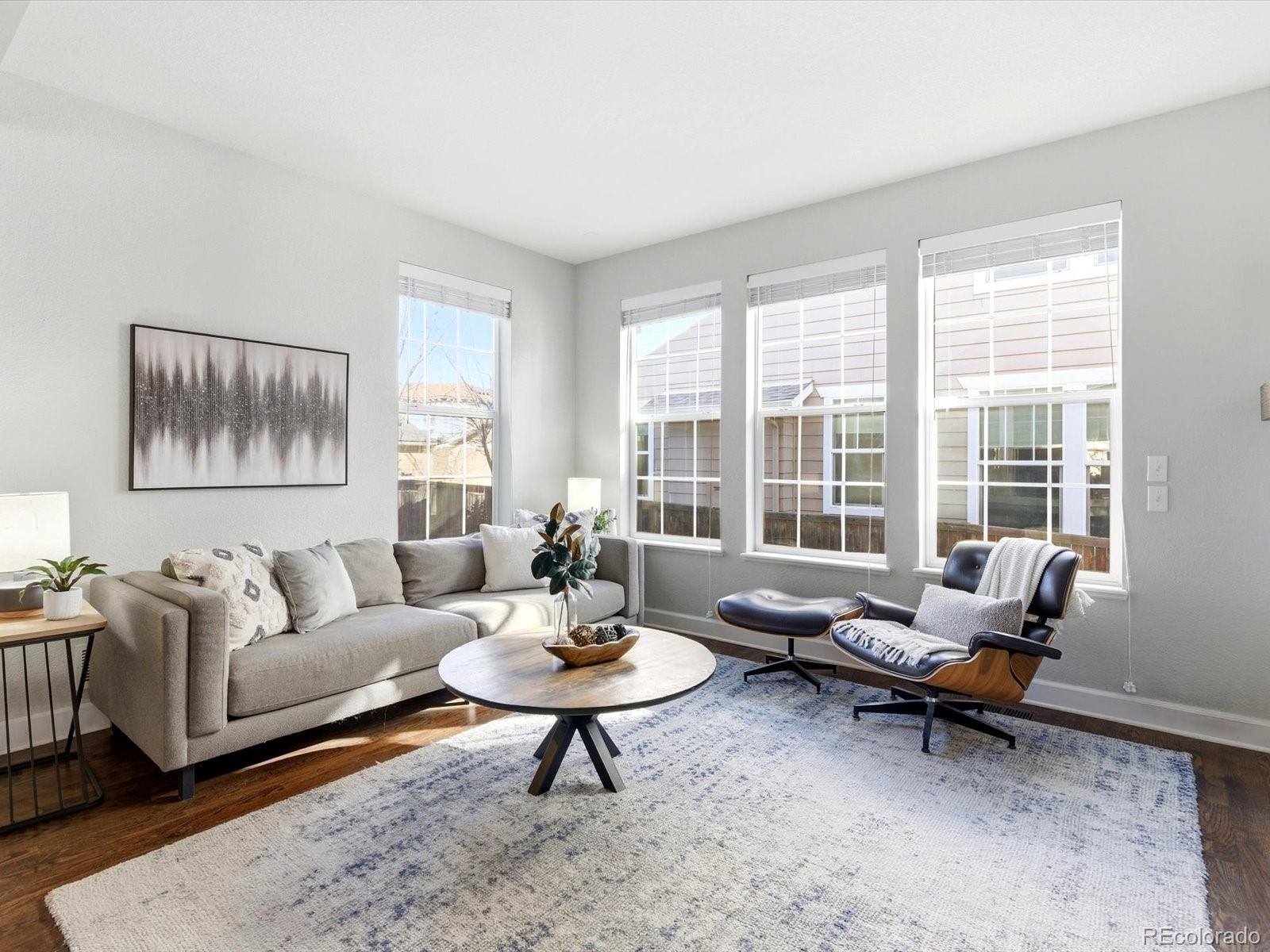 2691 Spruce Street Denver, CO 80238 - Photo 11 of 36 a living room with furniture and a rug