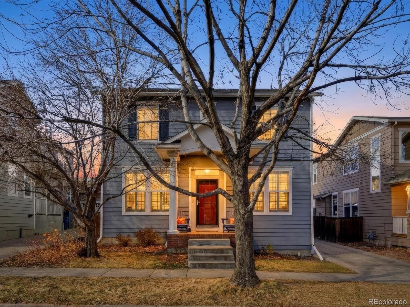 2691 Spruce Street Denver, CO 80238 - Photo 2 of 36 a view of house with yard and trees in the background