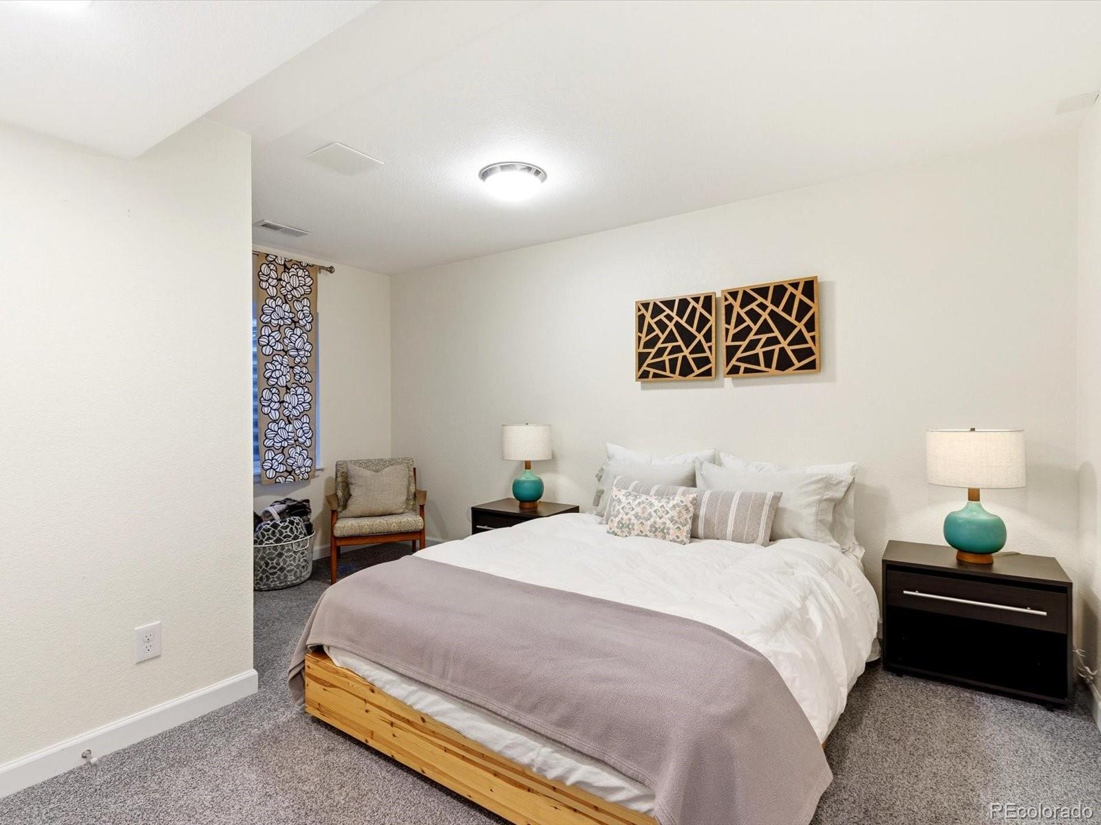 2691 Spruce Street Denver, CO 80238 - Photo 33 of 36 a bedroom with a bed and a lamp