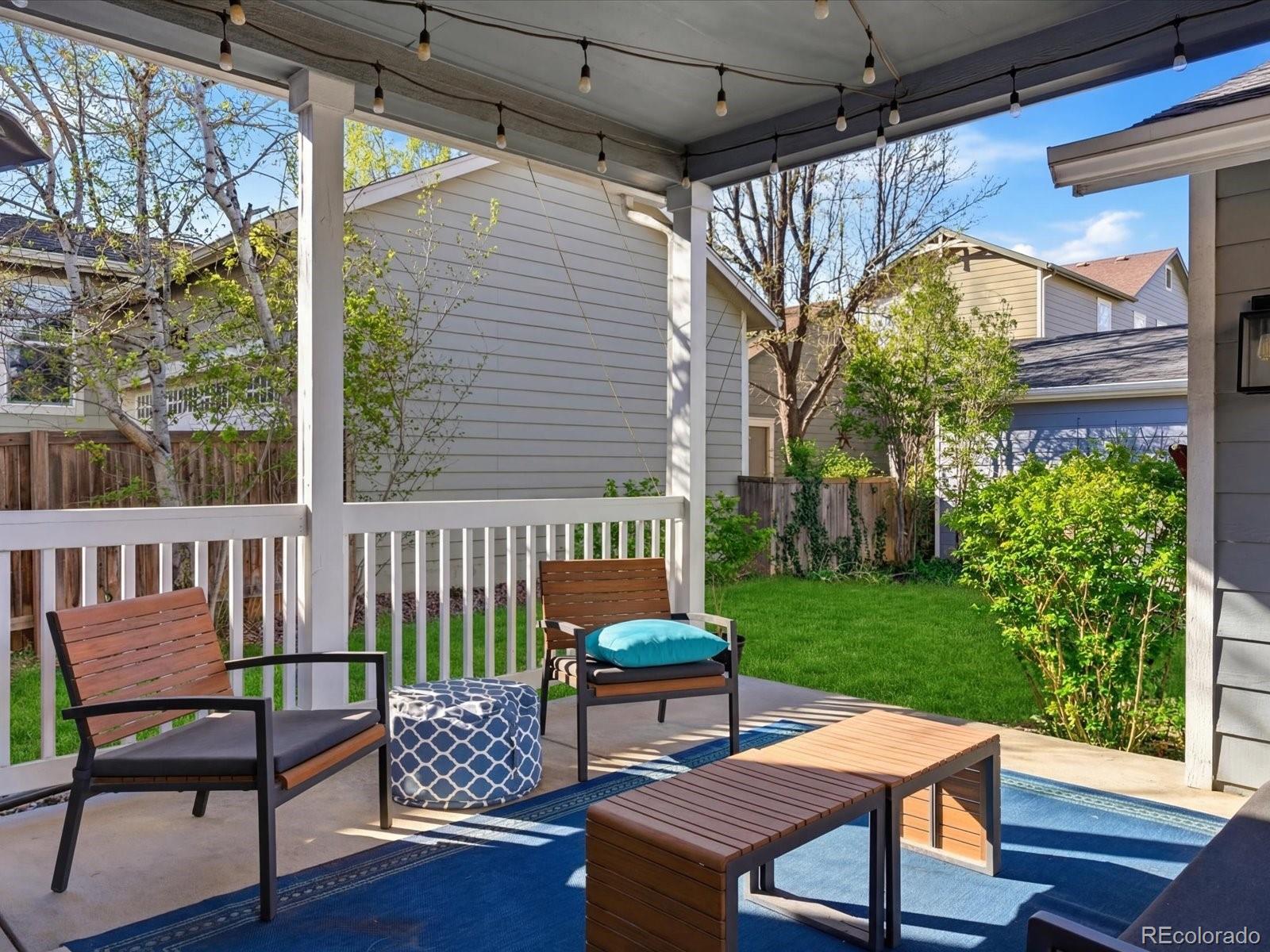 2691 Spruce Street Denver, CO 80238 - Photo 34 of 36 a view of a patio with a table chairs and a backyard