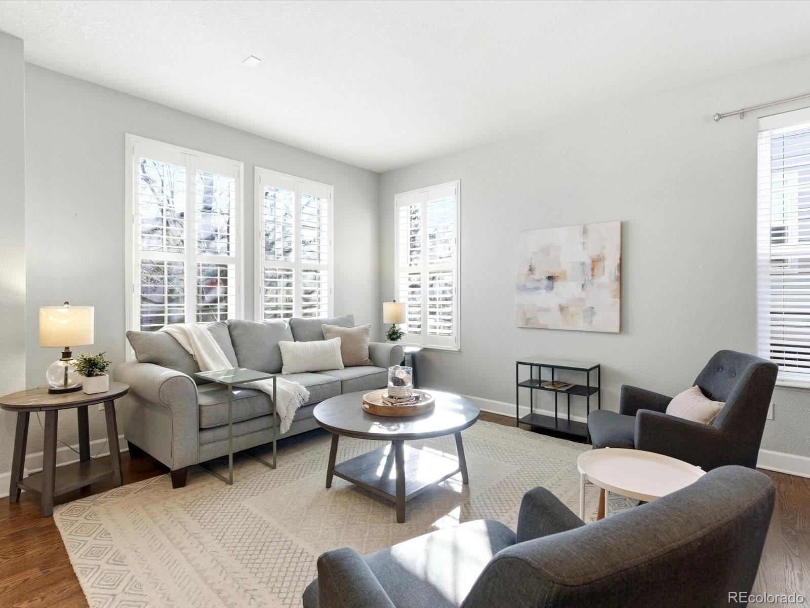 2691 Spruce Street Denver, CO 80238 - Photo 4 of 36 a living room with furniture and a large window