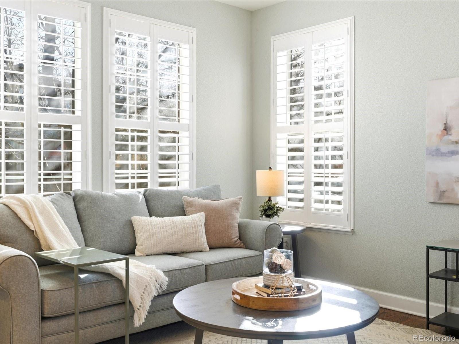 2691 Spruce Street Denver, CO 80238 - Photo 5 of 36 a living room with furniture and a large window