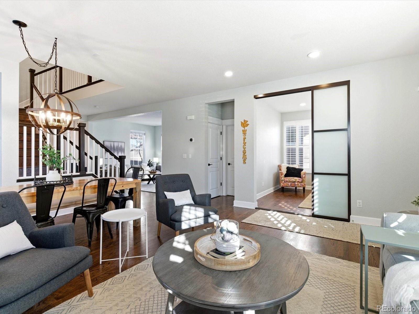 2691 Spruce Street Denver, CO 80238 - Photo 6 of 36 a living room with furniture and a dining table