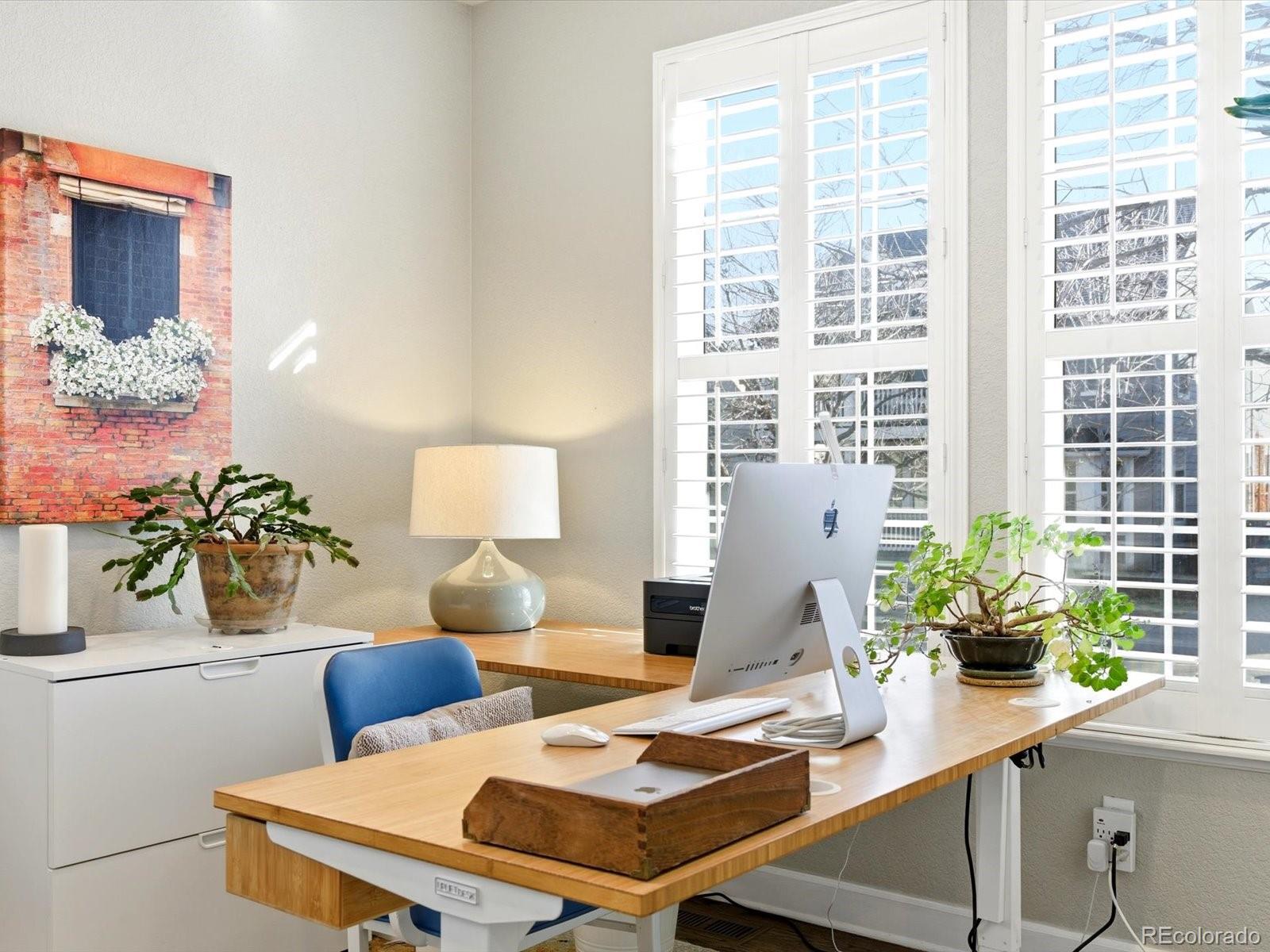 2691 Spruce Street Denver, CO 80238 - Photo 9 of 36 a view of a dining room with furniture and window