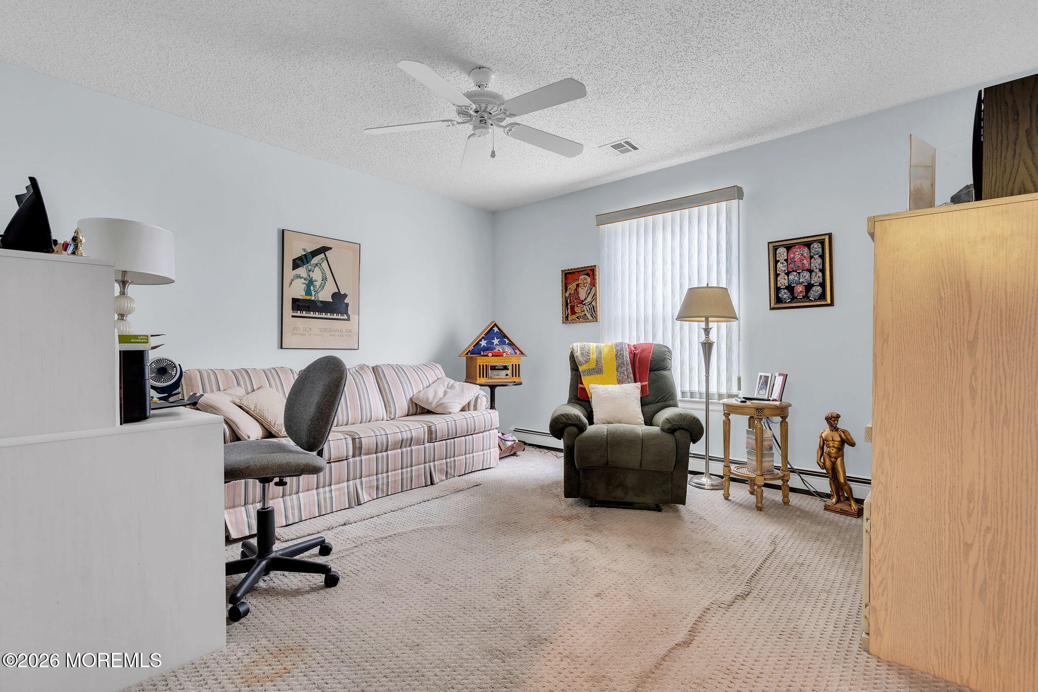 45 Winterton Drive Toms River, NJ 08757 - Photo 12 of 15 a living room with furniture and a flat screen tv