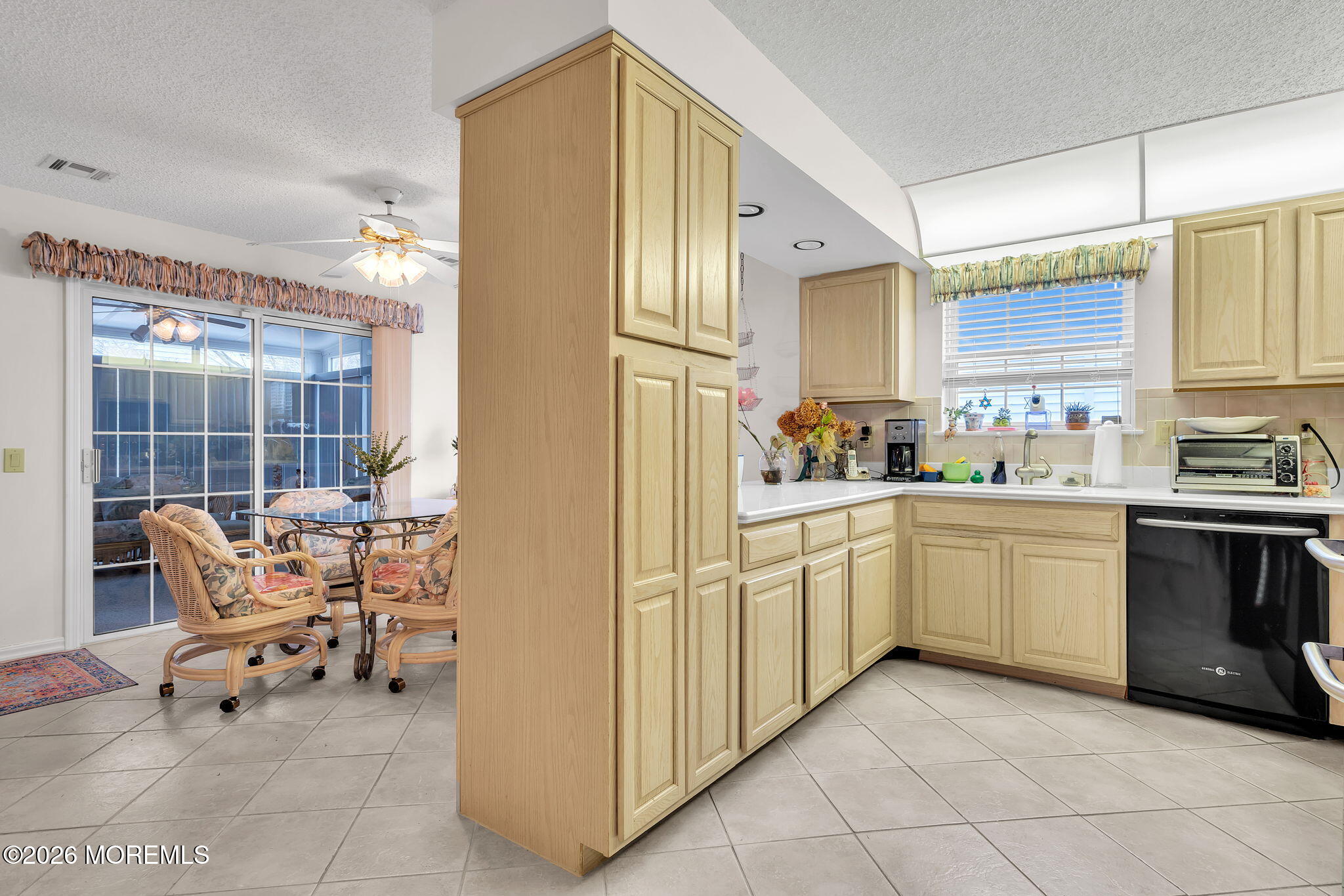 45 Winterton Drive Toms River, NJ 08757 - Photo 6 of 15 a kitchen with a sink cabinets and dining table chair