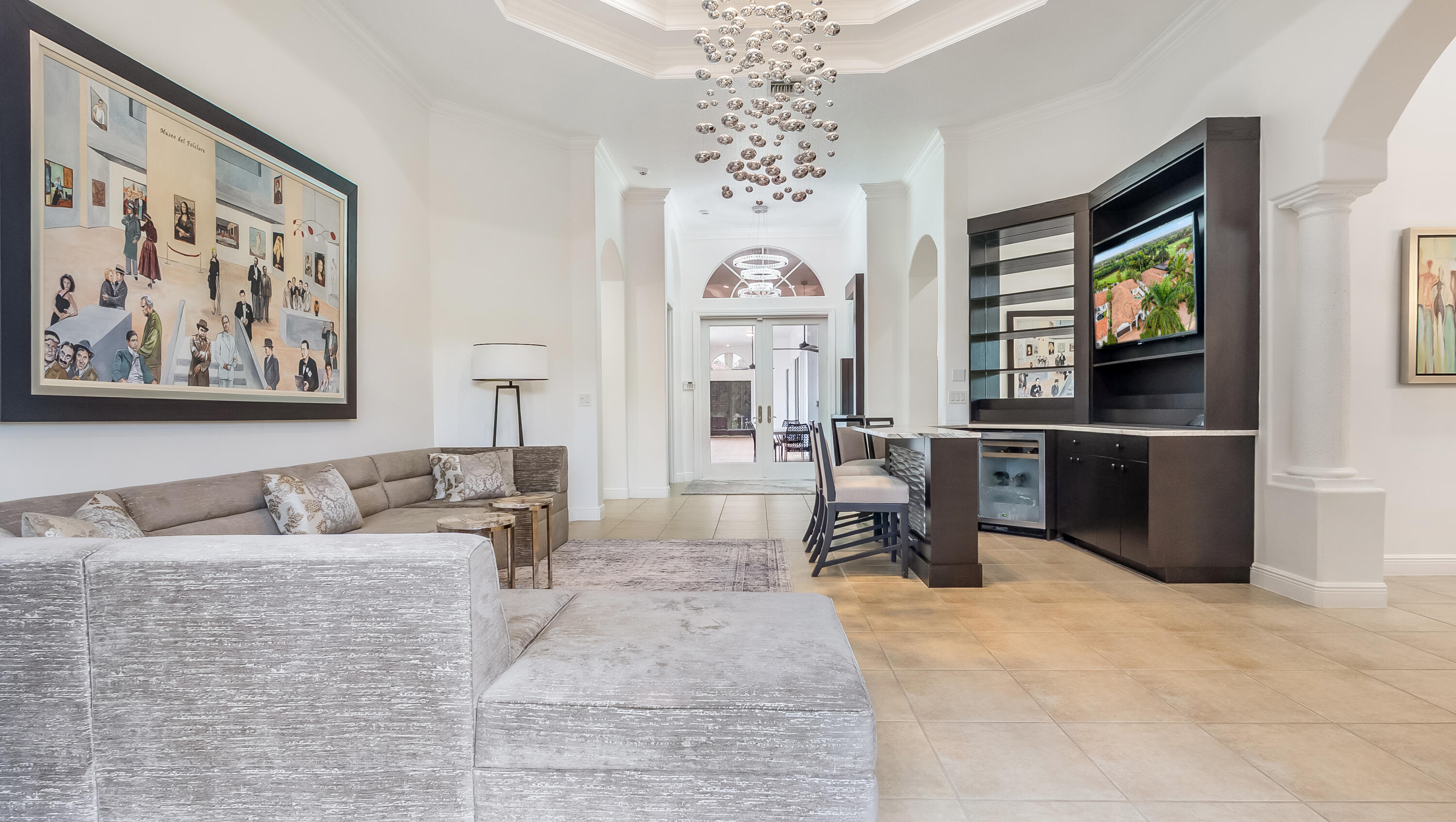8030 Laurel Ridge Court Delray Beach, FL 33446 - Photo 13 of 87 a living room with furniture a large window and a flat screen tv