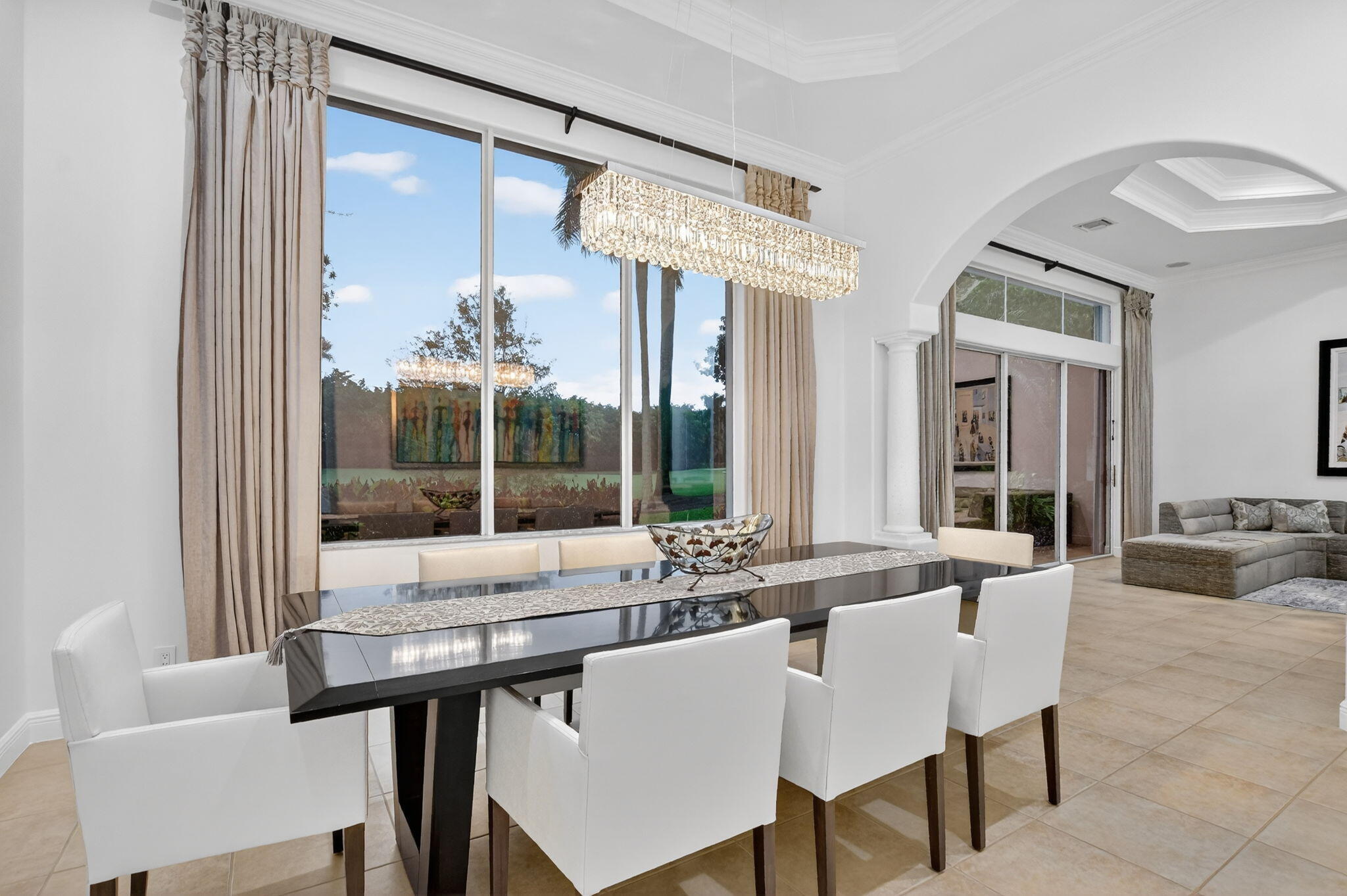 8030 Laurel Ridge Court Delray Beach, FL 33446 - Photo 18 of 87 a view of a dining room with furniture large windows and wooden floor