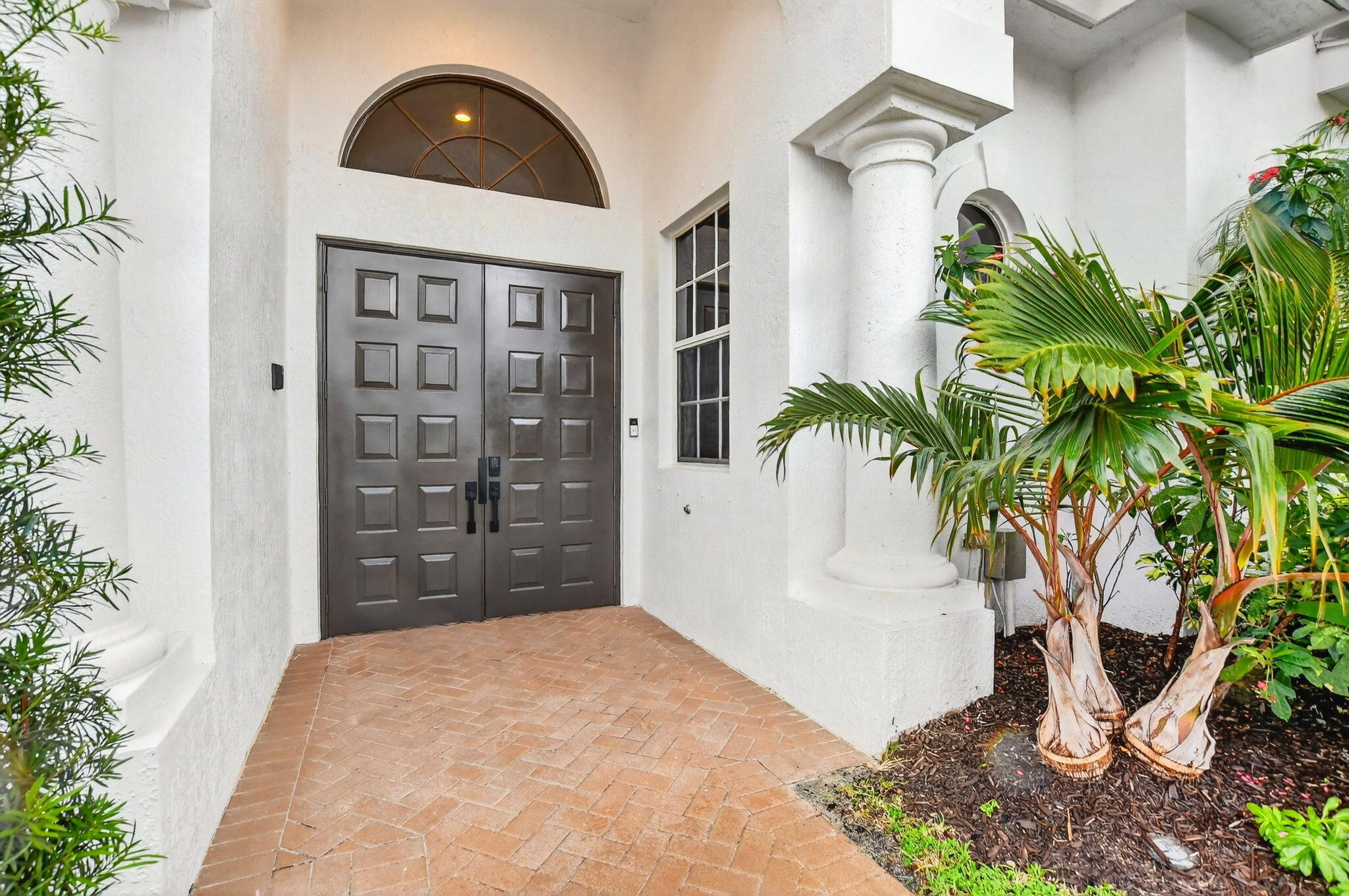 8030 Laurel Ridge Court Delray Beach, FL 33446 - Photo 2 of 87 a view of a entryway door of the house