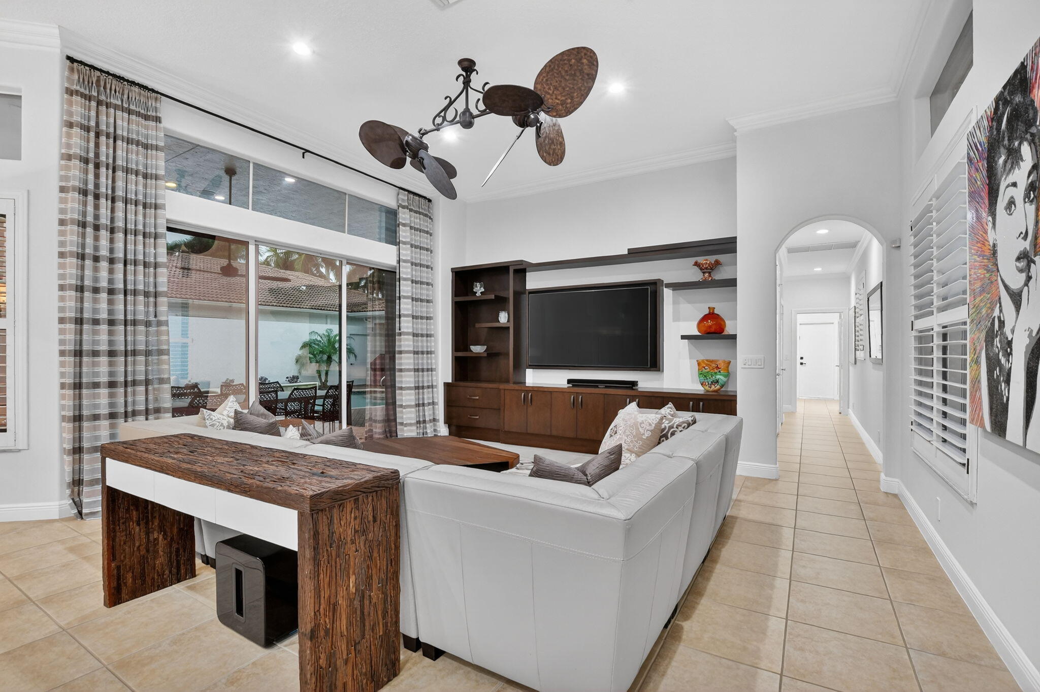 8030 Laurel Ridge Court Delray Beach, FL 33446 - Photo 31 of 87 a living room with furniture and a flat screen tv