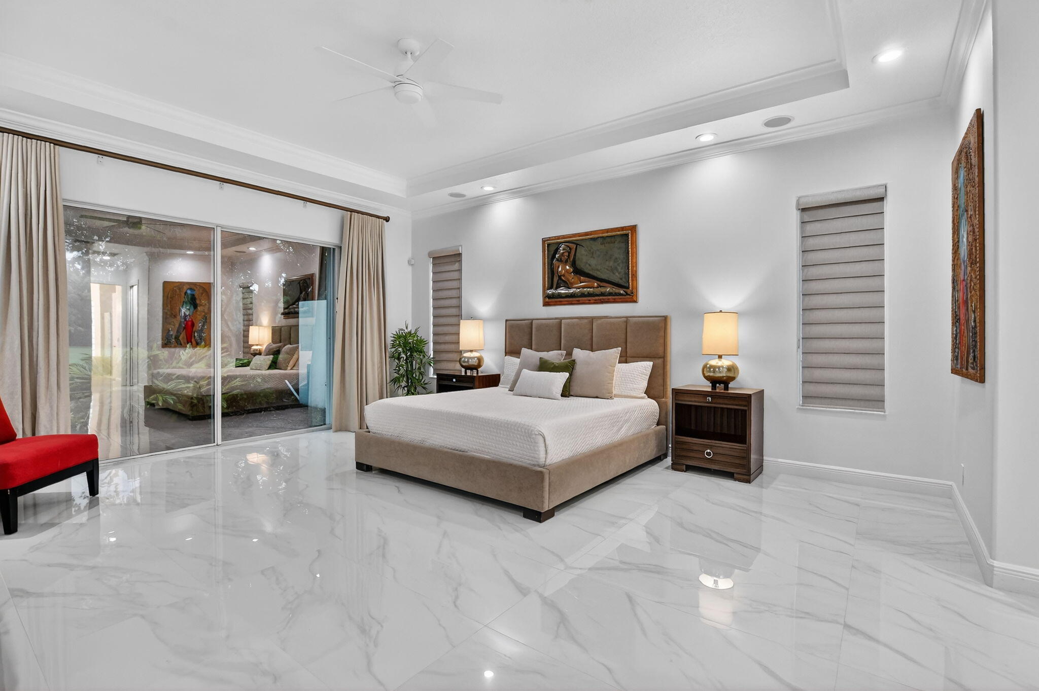 8030 Laurel Ridge Court Delray Beach, FL 33446 - Photo 36 of 87 a spacious bedroom with a bed and glass table