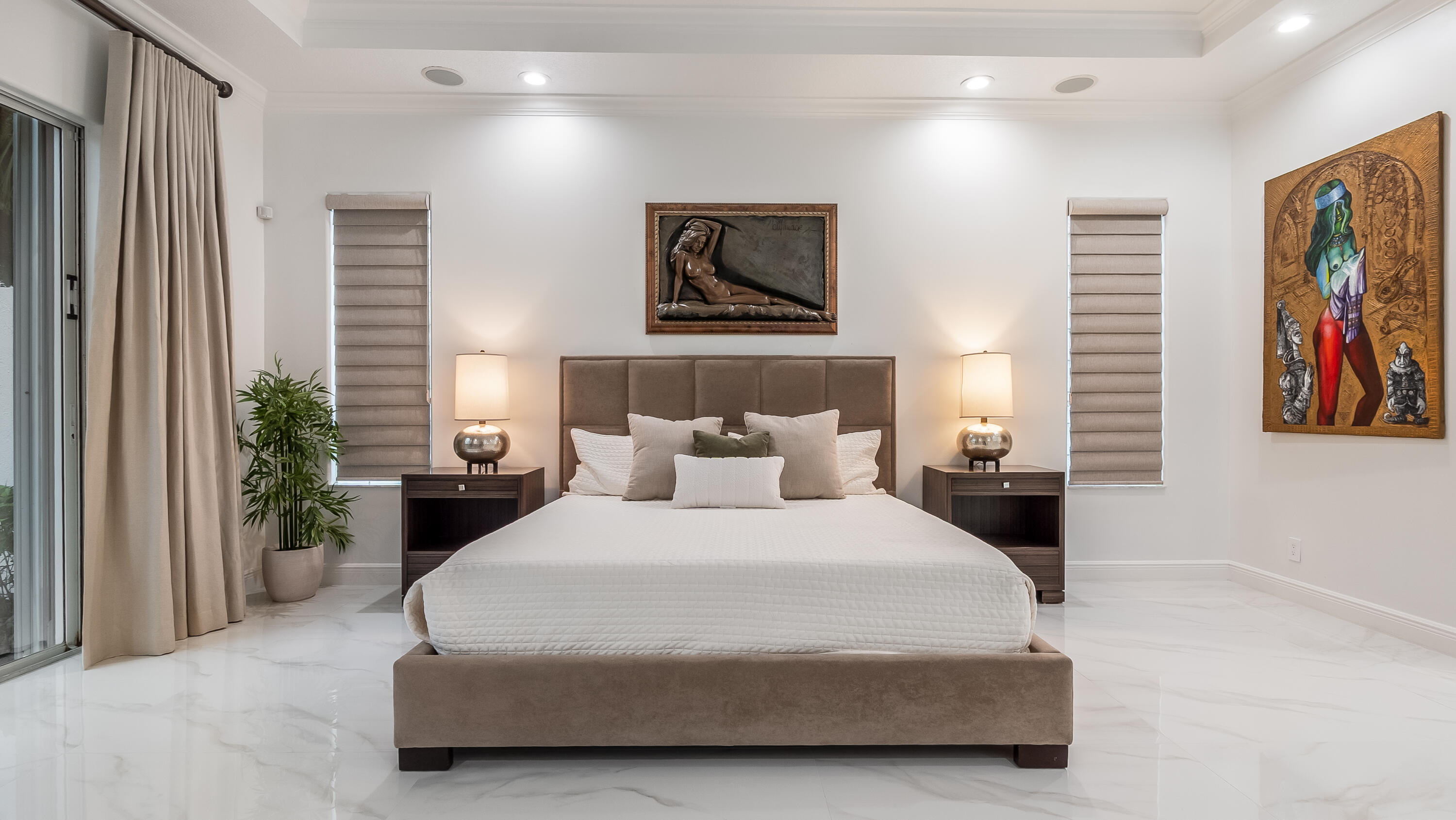 8030 Laurel Ridge Court Delray Beach, FL 33446 - Photo 39 of 87 a bedroom with a bed and a painting on the wall