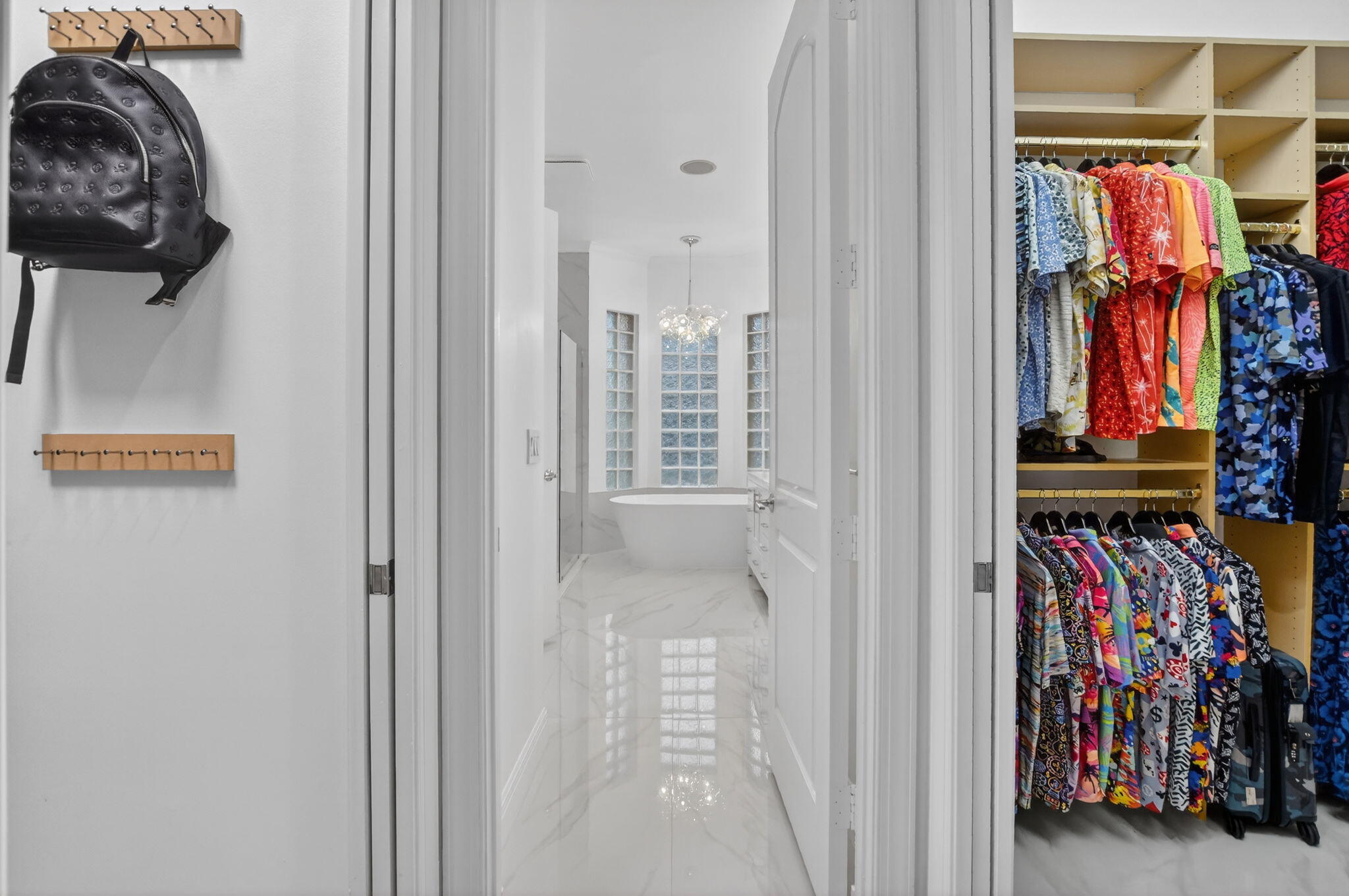 8030 Laurel Ridge Court Delray Beach, FL 33446 - Photo 42 of 87 a view of walk in closet with clothes and shoes