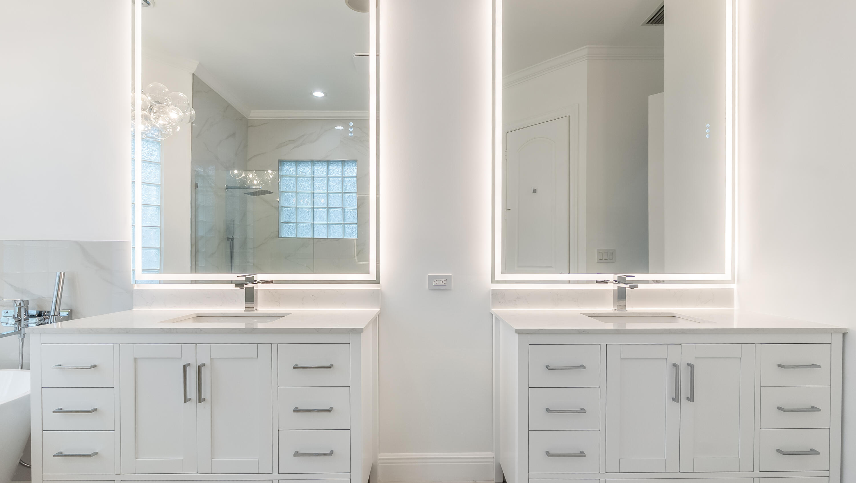 8030 Laurel Ridge Court Delray Beach, FL 33446 - Photo 45 of 87 a bathroom with double sink and a mirror