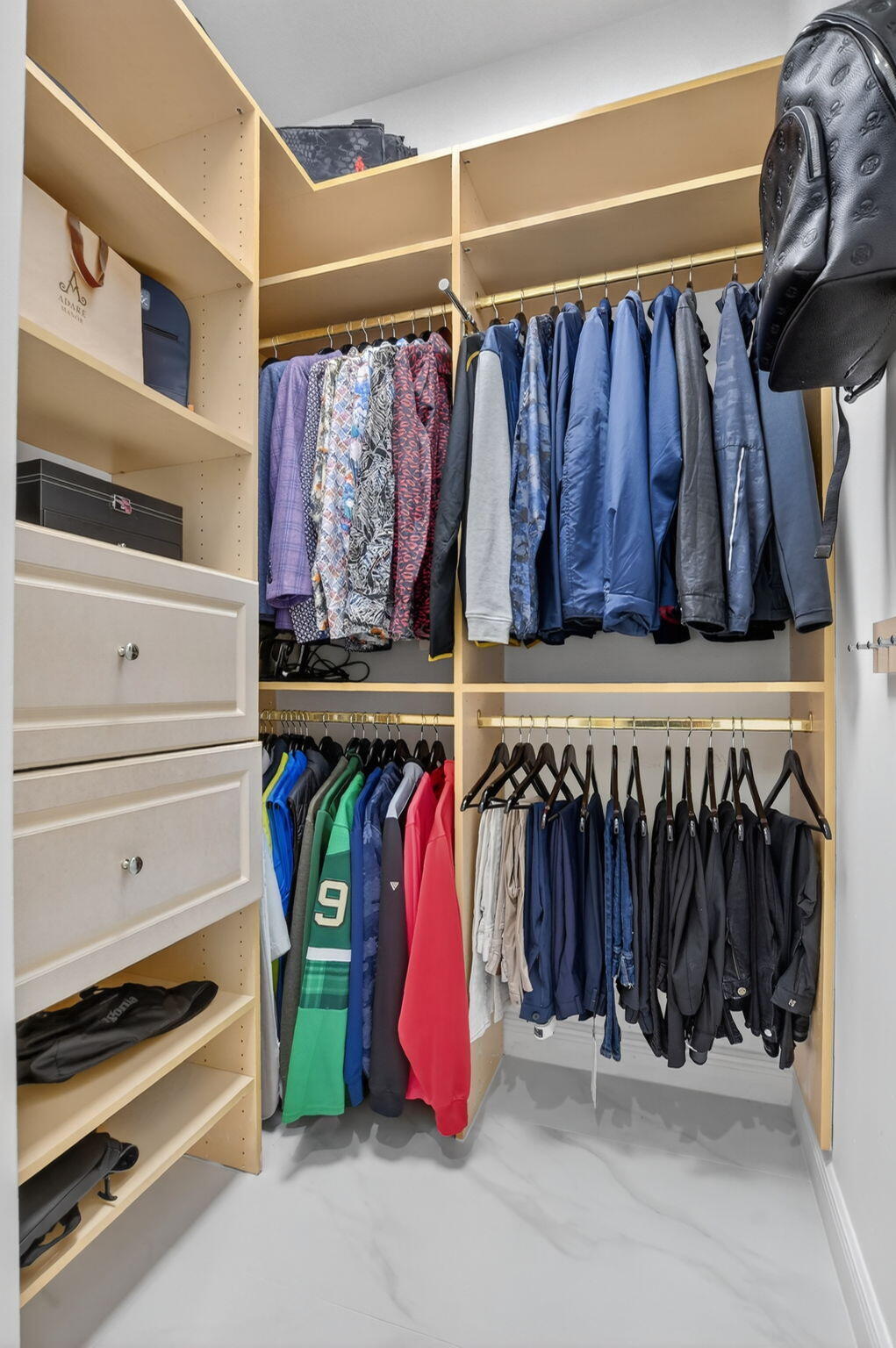 8030 Laurel Ridge Court Delray Beach, FL 33446 - Photo 49 of 87 a view of walk in closet with clothes