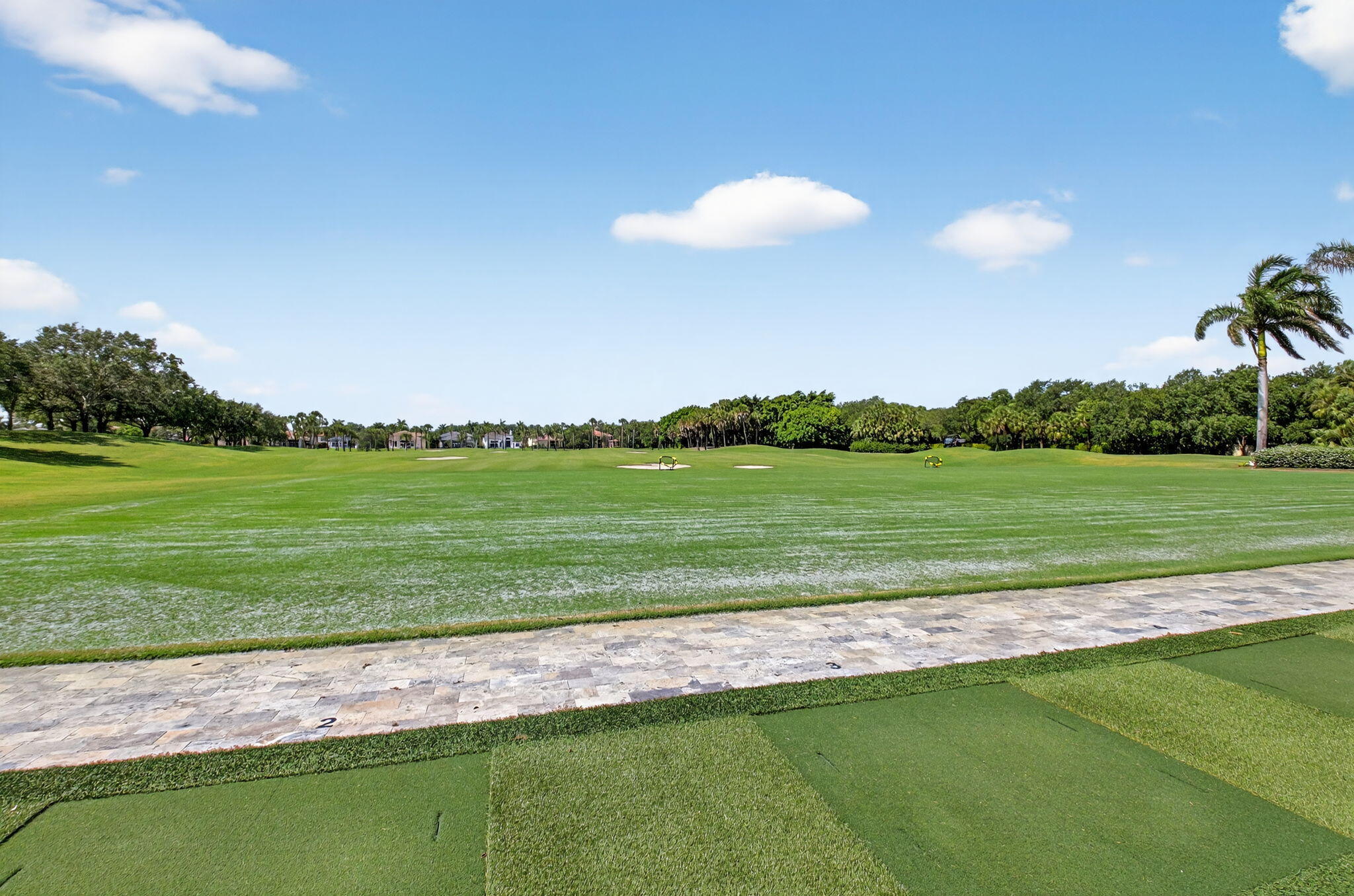 8030 Laurel Ridge Court Delray Beach, FL 33446 - Photo 77 of 87 a view of a golf course with a lake